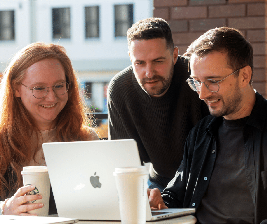 The Creed team working together on a laptop