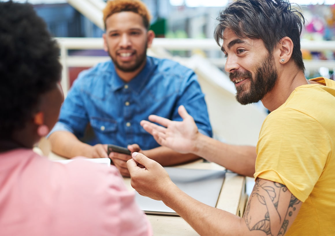 A group of colleagues meeting around a table
